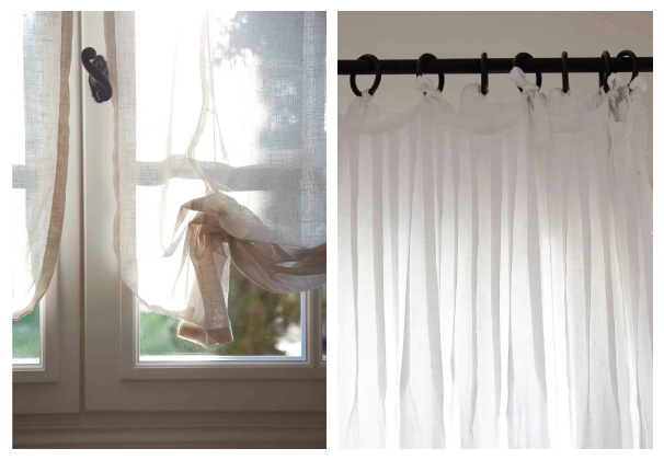 Provence style window frame with wrought-iron curtain rod and draperies.